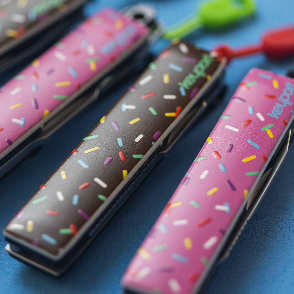 Keyport Faceplates with a chocolate and pink donut frosting