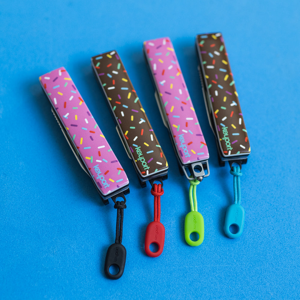 Keyport Faceplates with a chocolate and pink donut frosting design